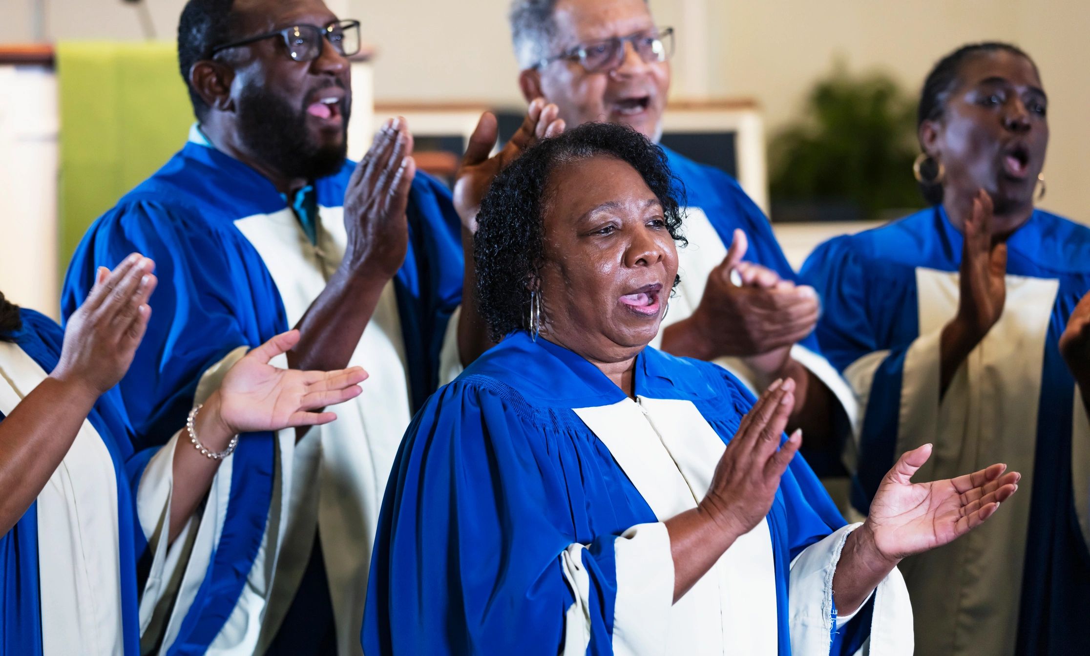 Choir members singing in church robes