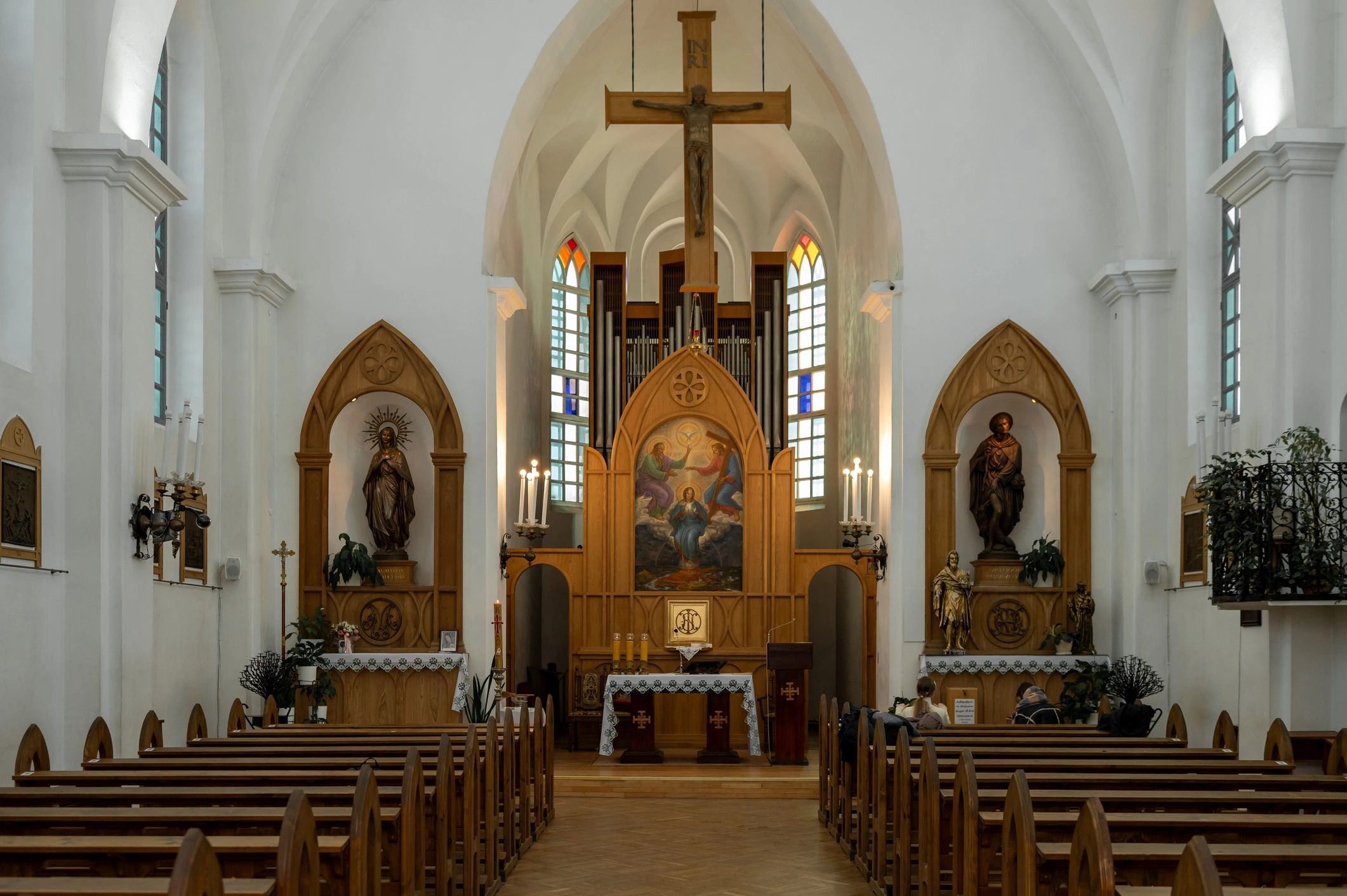 Church sanctuary interior with wooden pews and altar